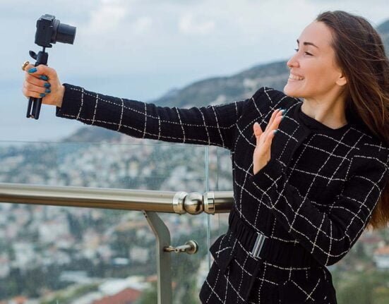 A girl vlogging with her camera