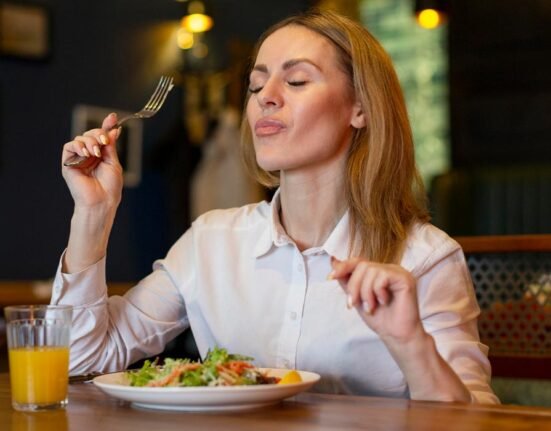 A woman enjoying her food.